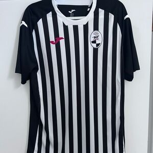 Five soccer jerseys of various sizes.